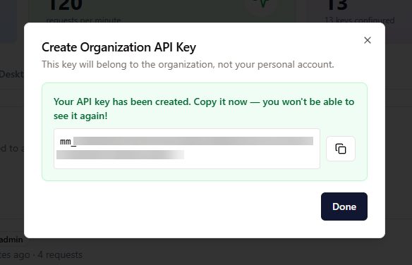 Dialogen “Create Organization API Key” med en kopier-knapp og en advarsel om å kopiere nøkkelen nå.
